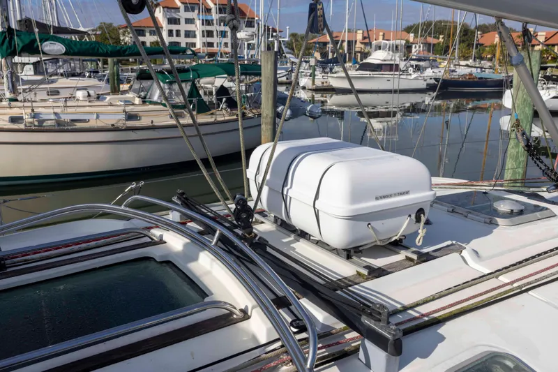 Slide: The Image of 2001 Jeanneau Sun Odyssey 43 DS sailboat docked in a marina, surrounded by other boats. - 12