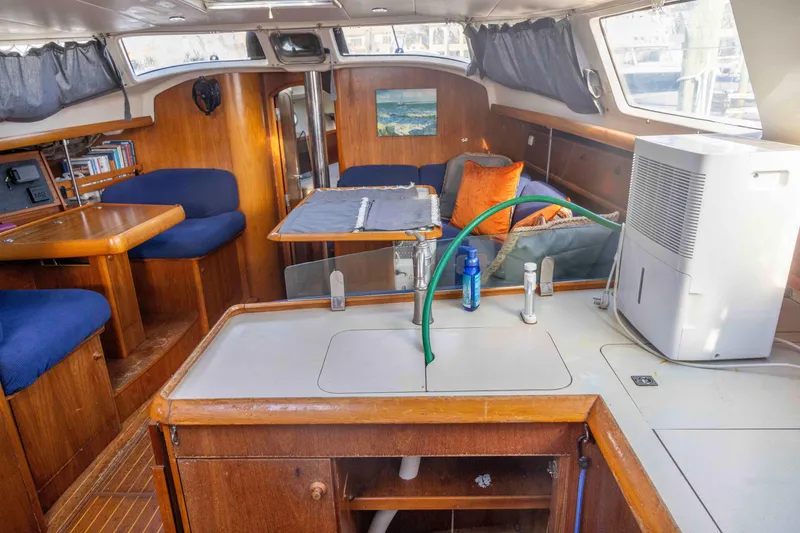 Slide: The Image of Interior of 2001 Jeanneau Sun Odyssey 43 DS sailboat with cozy seating and kitchenette. - 24