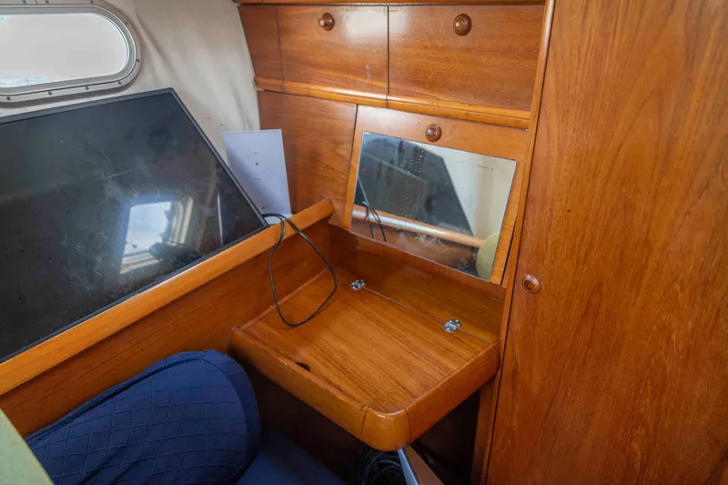 Slide: The Image of Interior of 2001 Jeanneau Sun Odyssey 43 DS with wooden cabinetry and mirror. - 28