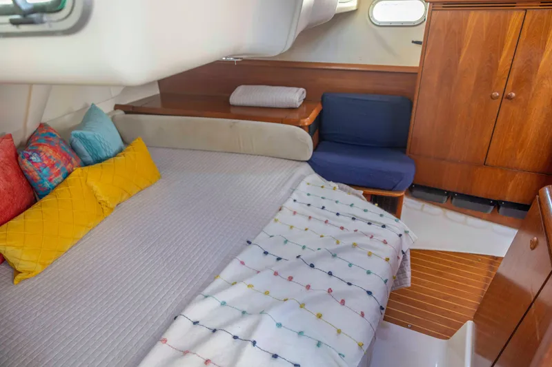 Slide: The Image of Cozy cabin interior of 2001 Jeanneau Sun Odyssey 43 DS with colorful pillows and wooden furnishings. - 32