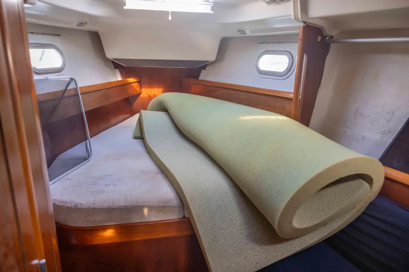 Slide: The Image of 2001 Jeanneau Sun Odyssey 43 DS cabin interior with rolled mattress. - 33