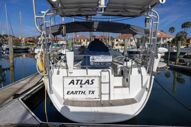 Slide: The Image of Jeanneau Sun Odyssey 43 DS yacht docked, rear view, 2001 model, marina setting. - 4