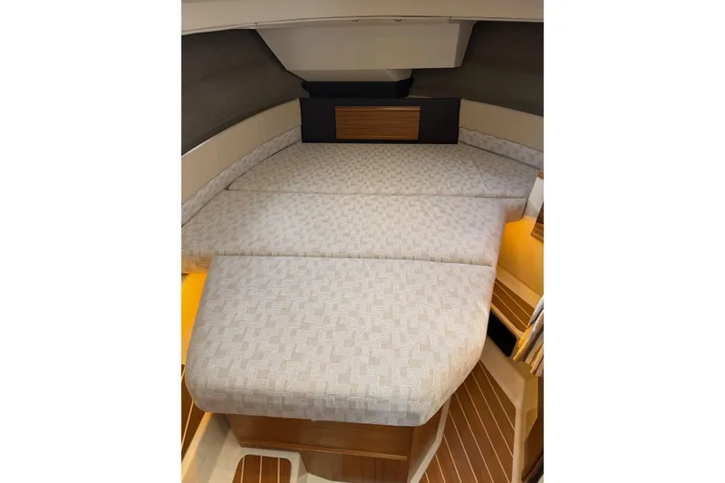 Slide: The Image of 2024 Ranger Tugs R-29 CB interior cabin with comfortable bed and modern design. - 16