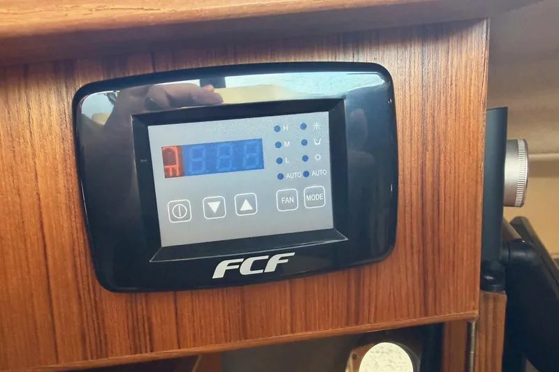 Slide: The Image of Control panel on 2024 Ranger Tugs R-29 CB boat, featuring FCF display. - 20