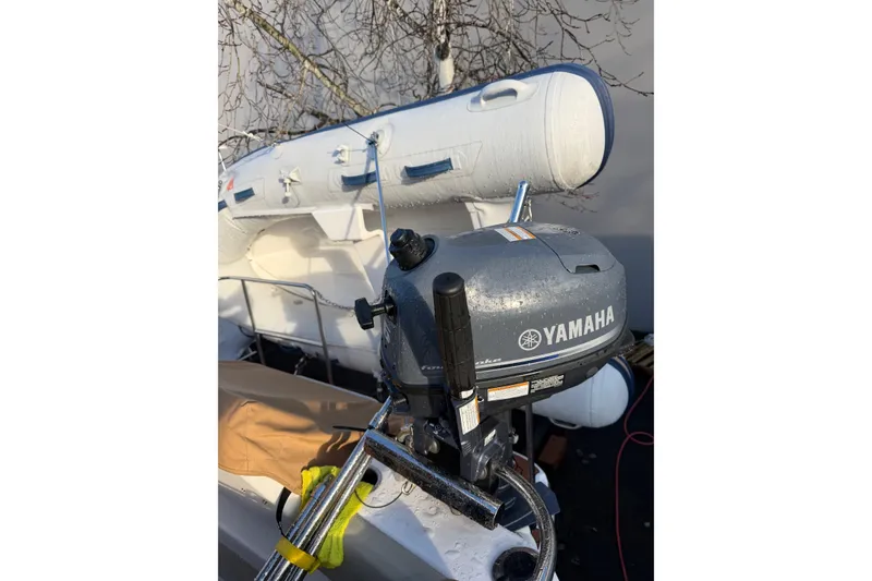 Slide: The Image of 2024 Ranger Tugs R-29 CB with Yamaha outboard motor and inflatable boat. - 4