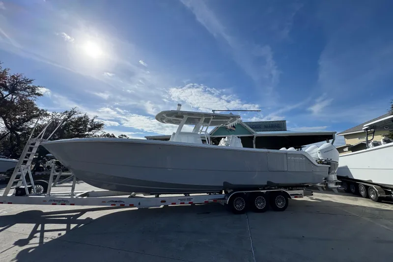 The Image of 2026 Invincible 36 Catamaran on trailer under clear blue sky. - 1