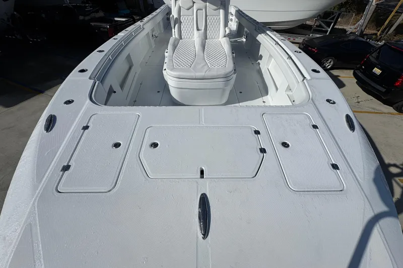 Slide: The Image of 2026 Invincible 36 Catamaran deck view with seating and storage compartments. - 18