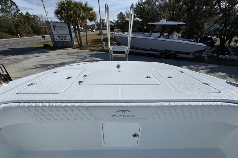 Slide: The Image of 2026 Invincible 36 Catamaran boat deck, parked at Grandeur Marine dealership. - 22