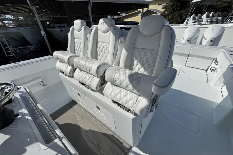 Slide: The Image of Luxurious seating on 2026 Invincible 36 Catamaran, featuring plush, diamond-stitched upholstery. - 29