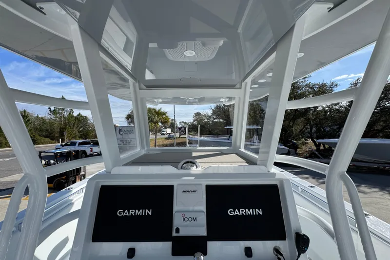 Slide: The Image of 2026 Invincible 36 Catamaran cockpit with Garmin displays and modern navigation equipment. - 34