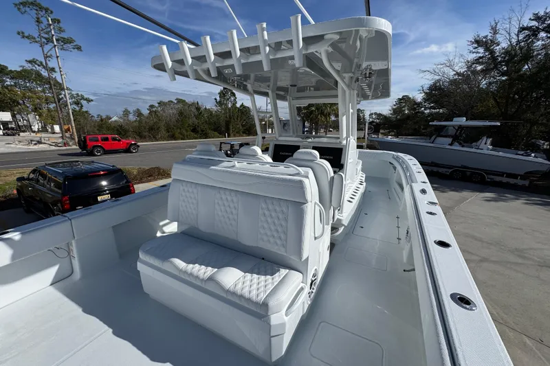 Slide: The Image of 2026 Invincible 36 Catamaran with sleek white seating and modern design. - 39