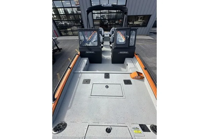 Slide: The Image of 2026 SeaArk ProCat 240 boat interior with dual seats and storage compartments. - 3