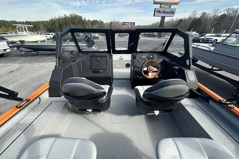 Slide: The Image of Interior view of 2026 SeaArk ProCat 240 boat with dual seats and dashboard. - 7