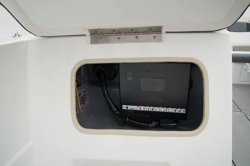 Slide: The Image of Manufacturer Provided Image: Electrical compartment of 2025 Tahoe T21 boat, showcasing wiring and components. - 24