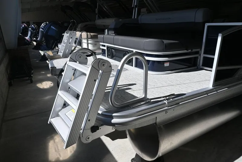 Slide: The Image of 2026 Bennington S Swingback 23 SSB pontoon boat with ladder and seating. - 5