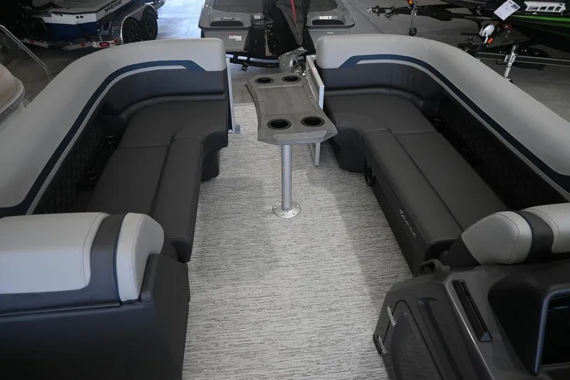 Slide: The Image of 2026 Bennington S Swingback 23 SSB interior with plush seating and central table. - 9