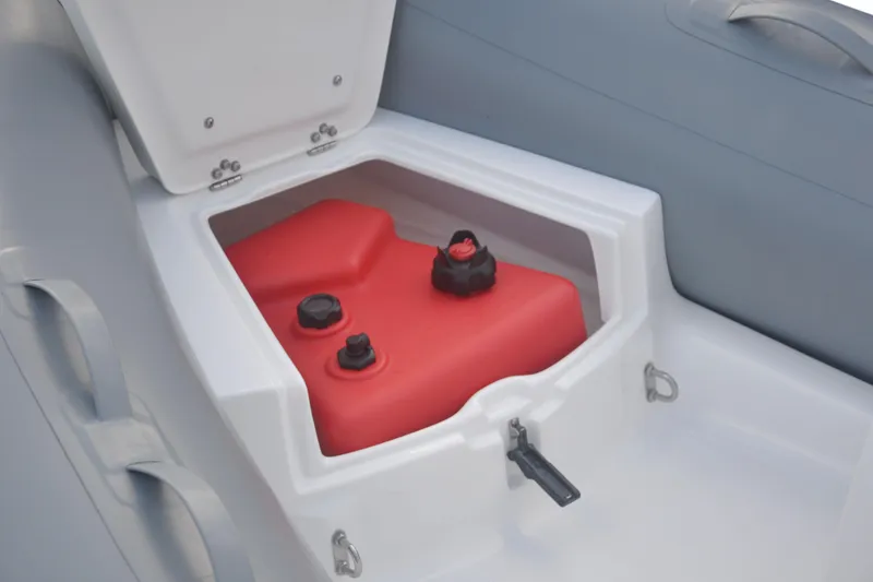 Slide: The Image of 2026 AB Inflatables Mares 11 VSX boat storage compartment with red fuel tank. - 1