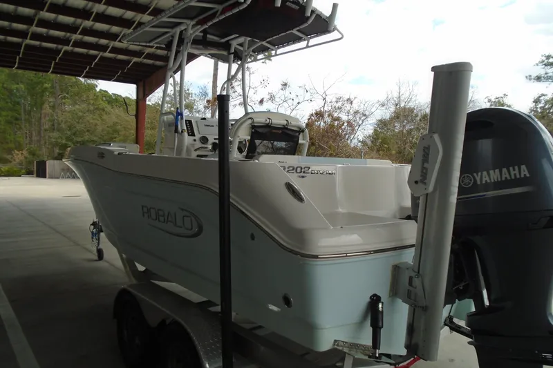 Slide: The Image of 2021 Robalo R202 Explorer boat on trailer with Yamaha outboard motor. - 15
