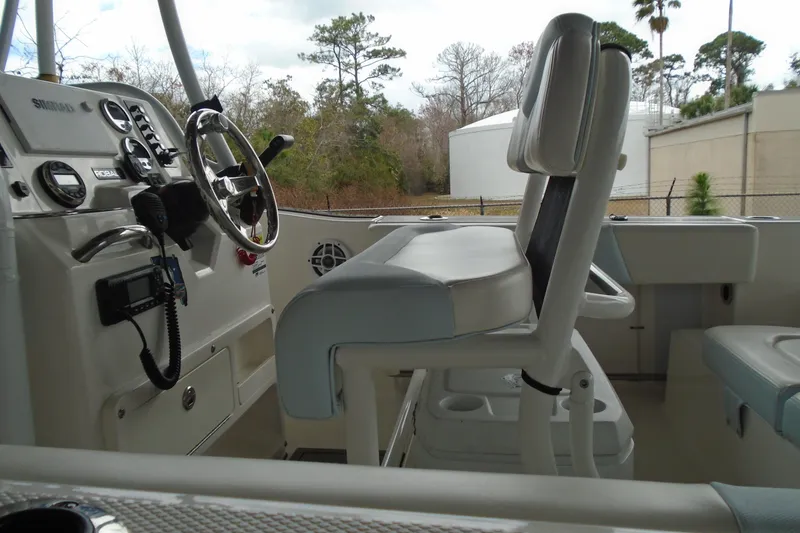 Slide: The Image of 2021 Robalo R202 Explorer boat interior with steering wheel and seating. - 17