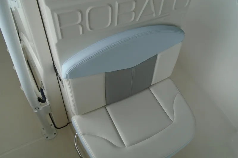 Slide: The Image of 2021 Robalo R202 Explorer boat seat with embossed branding and stylish upholstery. - 22