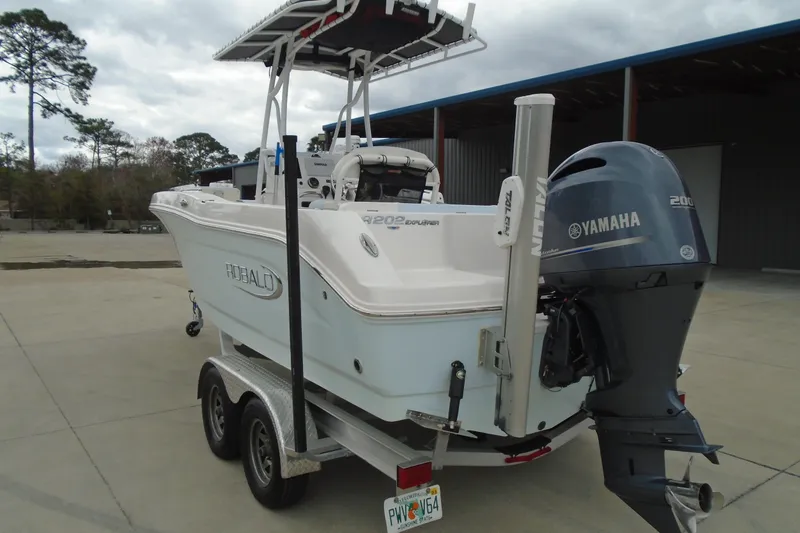Slide: The Image of 2021 Robalo R202 Explorer boat with Yamaha engine on trailer. - 25