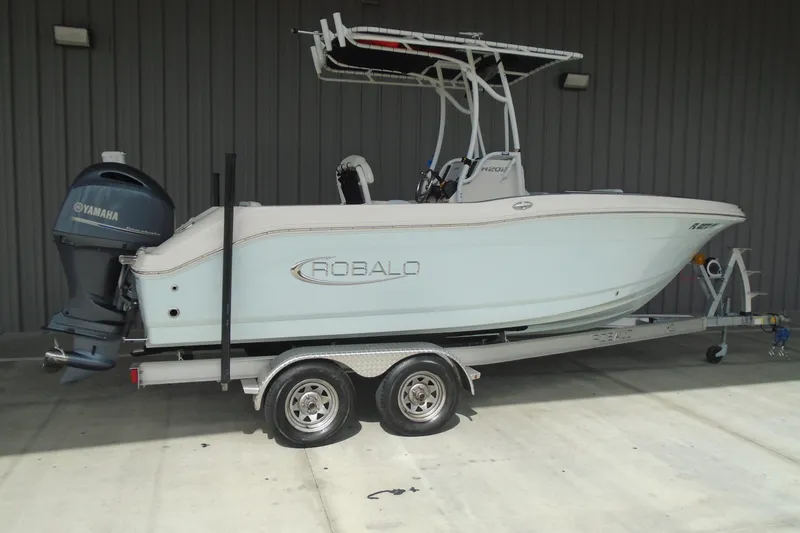 Slide: The Image of 2021 Robalo R202 Explorer boat on trailer with Yamaha outboard motor. - 3
