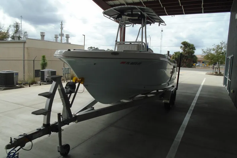 Slide: The Image of 2021 Robalo R202 Explorer boat on trailer in covered storage area. - 6