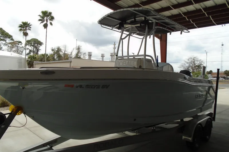 Slide: The Image of 2021 Robalo R202 Explorer boat on trailer under shelter. - 7