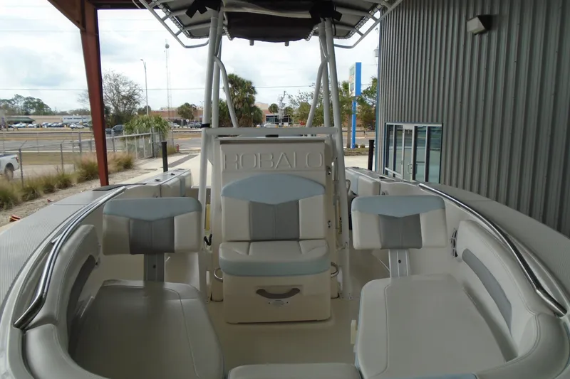 Slide: The Image of 2021 Robalo R202 Explorer boat interior with seating and helm station. - 8