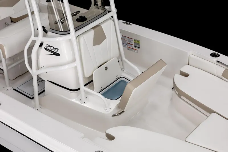 Slide: The Image of 2026 Robalo 206 Cayman boat interior with seating and storage compartments. - 4