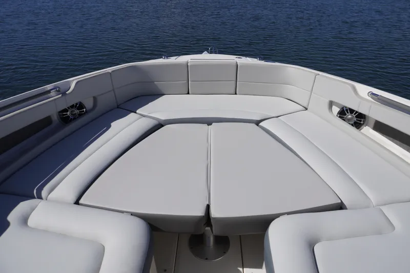 Slide: The Image of 2020 Sea Ray SLX 310 Outboard boat with spacious seating on calm water. - 21