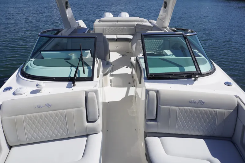Slide: The Image of 2020 Sea Ray SLX 310 Outboard boat interior with luxurious seating and windshield. - 23
