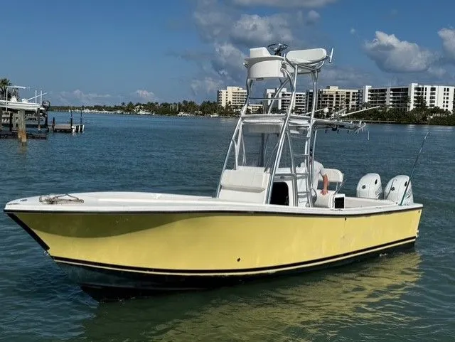 The Image of Yellow 2004 Regulator 26 Center Console boat on the water. - 0