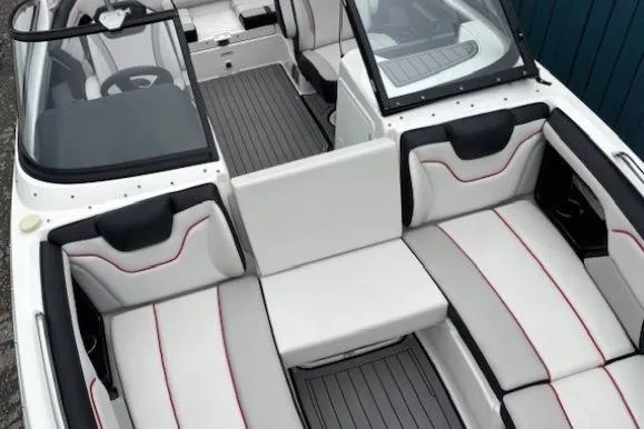 Slide: The Image of 2018 Yamaha Boats 212X interior with sleek seating and modern design. - 13