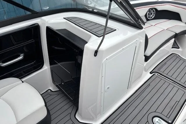 Slide: The Image of 2018 Yamaha Boats 212X interior with seating and storage compartments. - 14