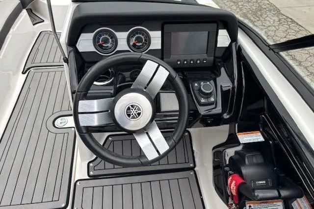 Slide: The Image of 2018 Yamaha Boats 212X dashboard with steering wheel and control panel. - 20
