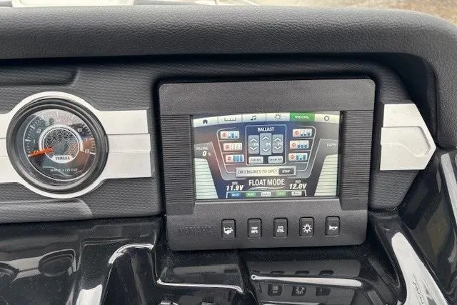 Slide: The Image of Dashboard of 2018 Yamaha Boats 212X with digital display and controls. - 22