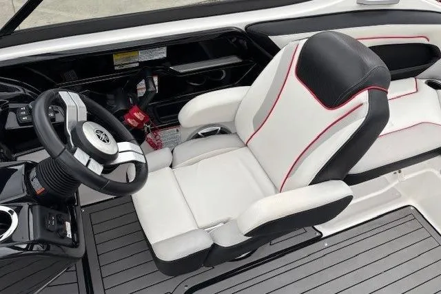 Slide: The Image of 2018 Yamaha Boats 212X cockpit with sleek steering and comfortable seating. - 23