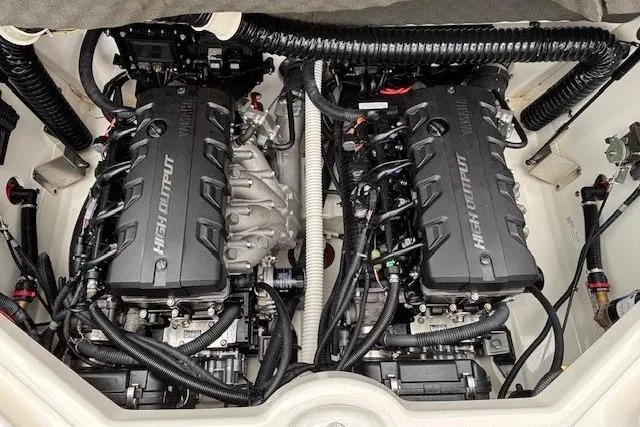 Slide: The Image of Engine compartment of a 2018 Yamaha Boats 212X, featuring dual high-output engines. - 32
