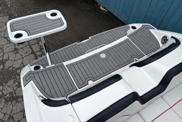 Slide: The Image of 2018 Yamaha Boats 212X swim platform with table and cup holders. - 34