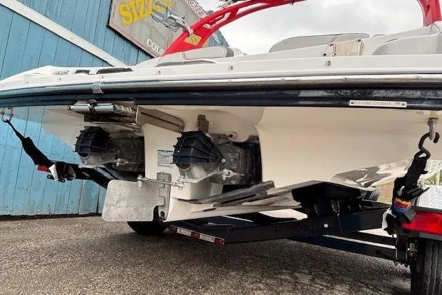 Slide: The Image of 2018 Yamaha Boats 212X on trailer, showcasing dual engines and sleek design. - 5