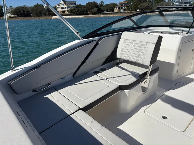 Slide: The Image of Interior of 2024 Sea Ray SPX 210 Outboard boat by the water. - 15