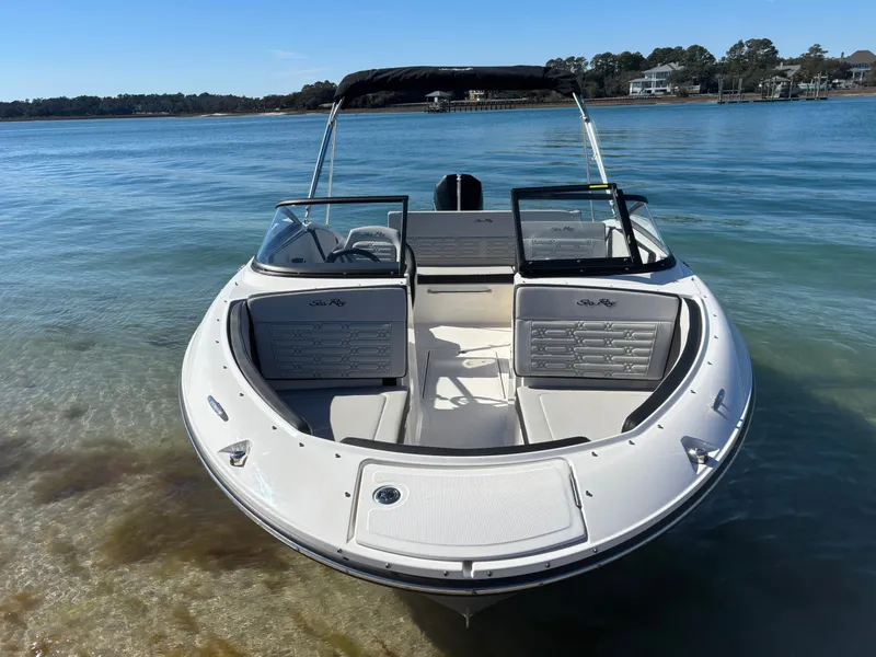 Slide: The Image of 2024 Sea Ray SPX 210 Outboard on calm water. - 2