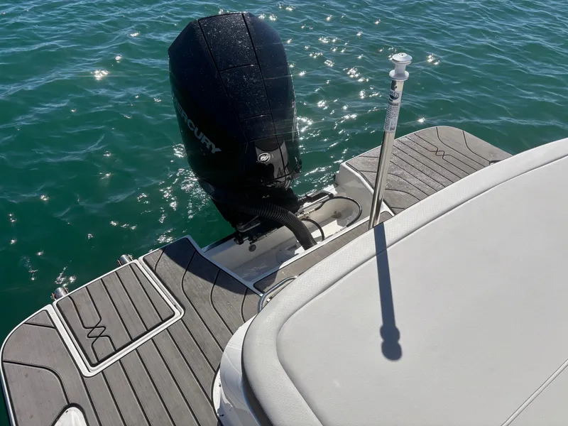 Slide: The Image of 2024 Sea Ray SPX 210 Outboard on water, engine view. - 22