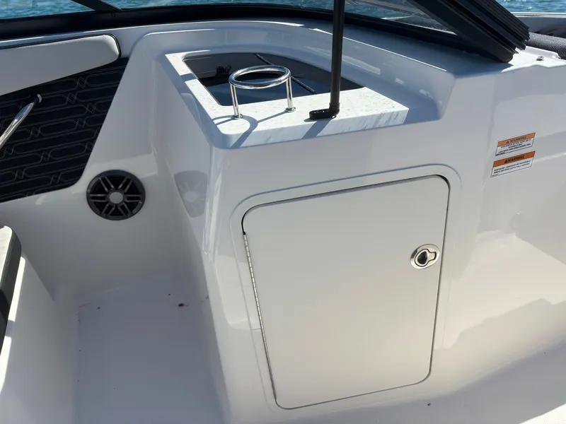 Slide: The Image of Interior of 2024 Sea Ray SPX 210 Outboard with storage compartment. - 26