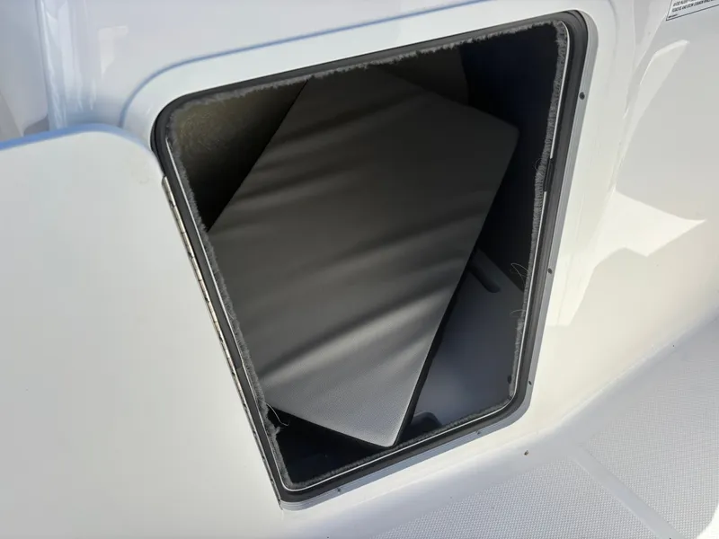 Slide: The Image of Storage compartment in 2024 Sea Ray SPX 210 Outboard boat. - 28