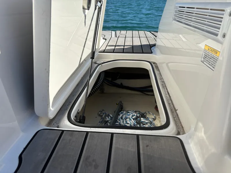 Slide: The Image of Storage compartment in Sea Ray SPX 210 Outboard 2024 boat. - 34