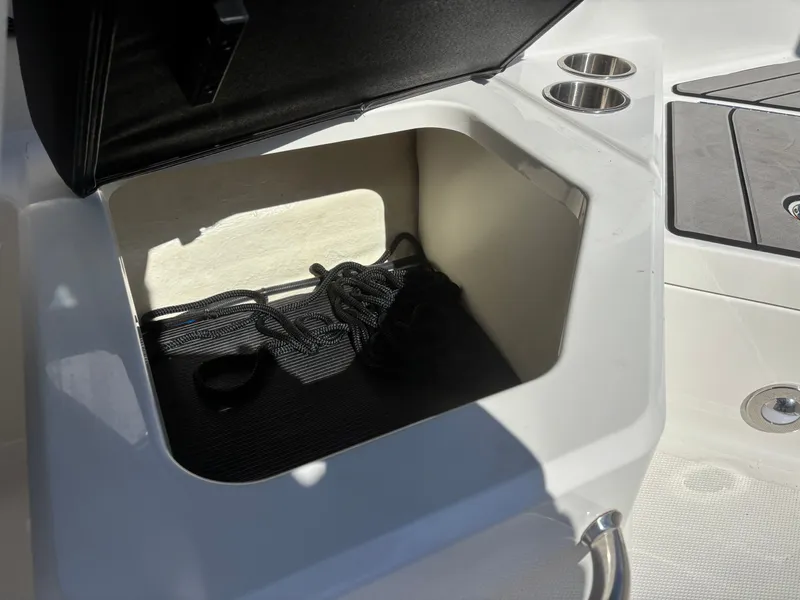 Slide: The Image of Storage compartment in 2024 Sea Ray SPX 210 Outboard boat. - 37