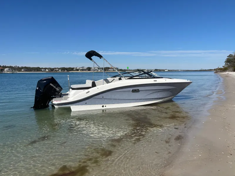 Slide: The Image of 2024 Sea Ray SPX 210 Outboard parked on a beach. - 49