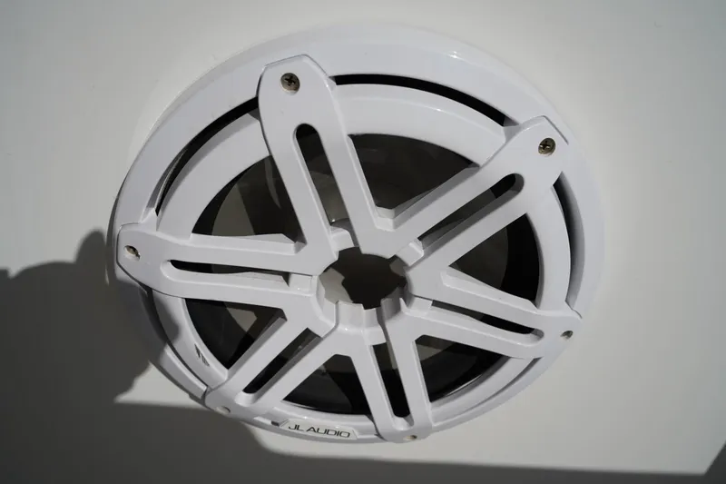 Slide: The Image of White JL Audio speaker on 2021 Sea Hunt Ultra 219 boat. - 19